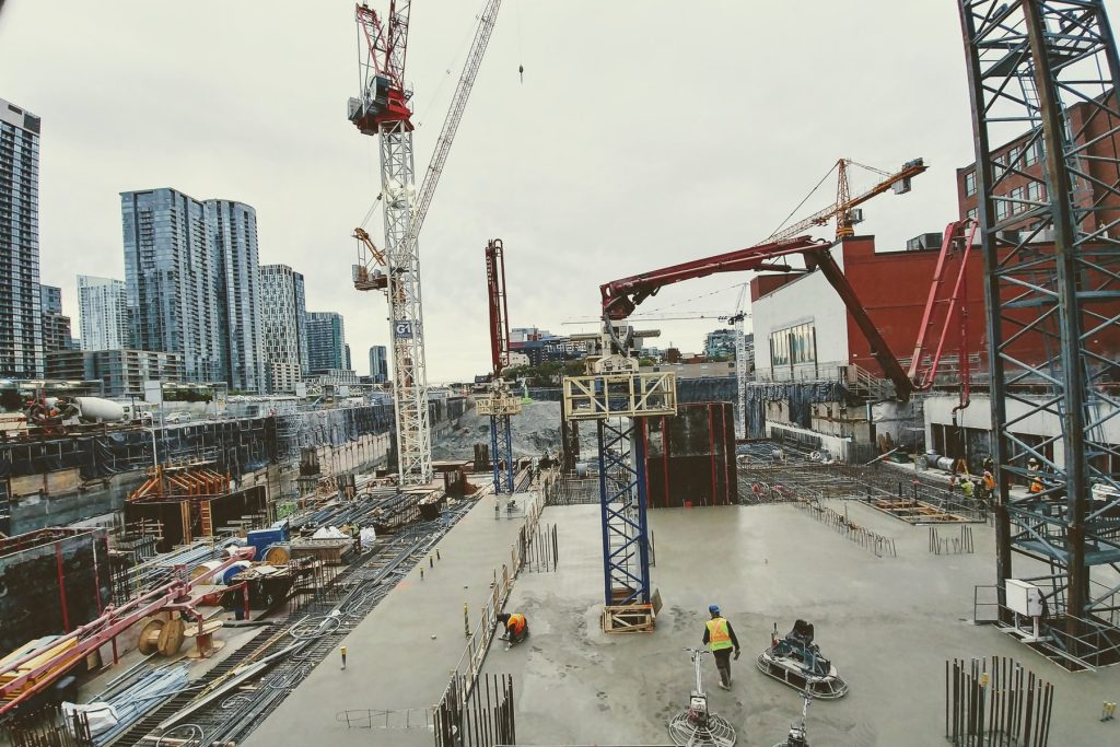 Podium slab construction with cranes at The Well